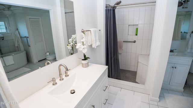 full bath featuring toilet, a stall shower, tile patterned flooring, and vanity