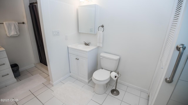 bathroom featuring toilet, tile patterned flooring, vanity, and a shower with curtain