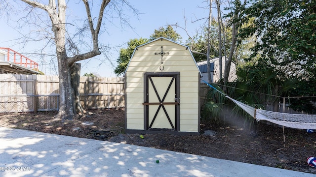 view of shed featuring a fenced backyard