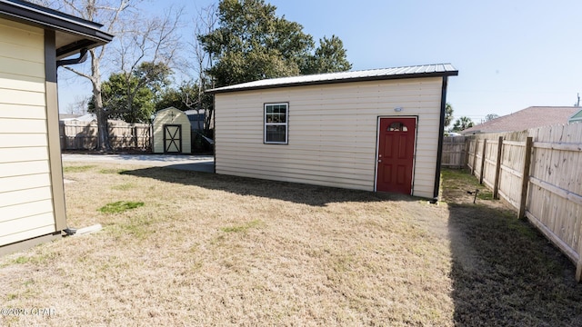 view of shed with a fenced backyard