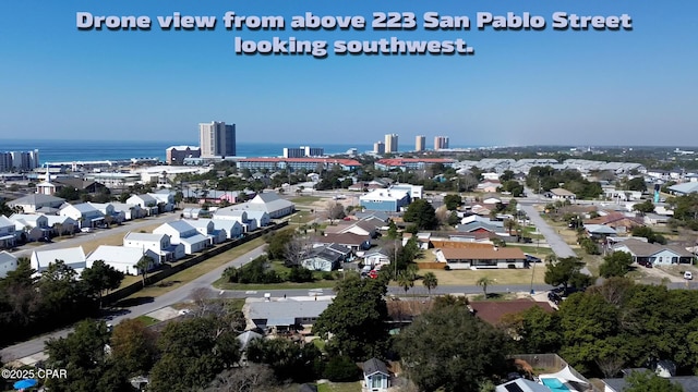 bird's eye view featuring a water view and a view of city