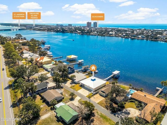 birds eye view of property with a water view