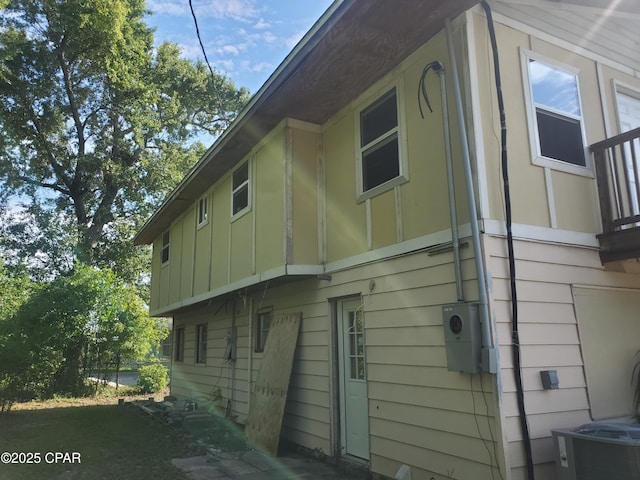 view of home's exterior with cooling unit