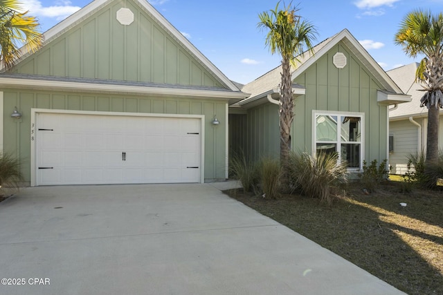 358 Sea Grove Way, Port St Joe, FL 32456 - view of front of home with board and batten siding, driveway, and an attached garage