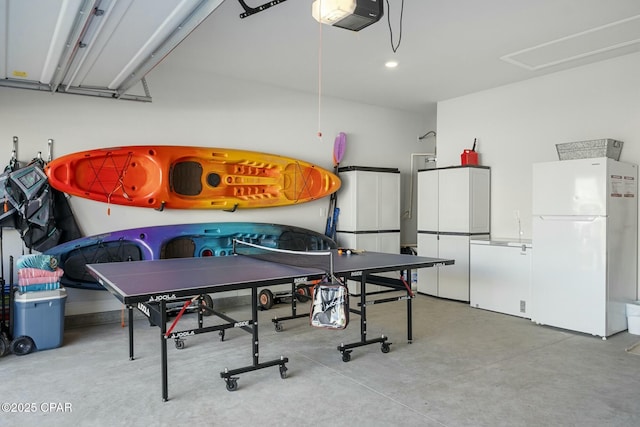 358 Sea Grove Way, Port St Joe, FL 32456 - game room featuring concrete floors, recessed lighting, and a garage