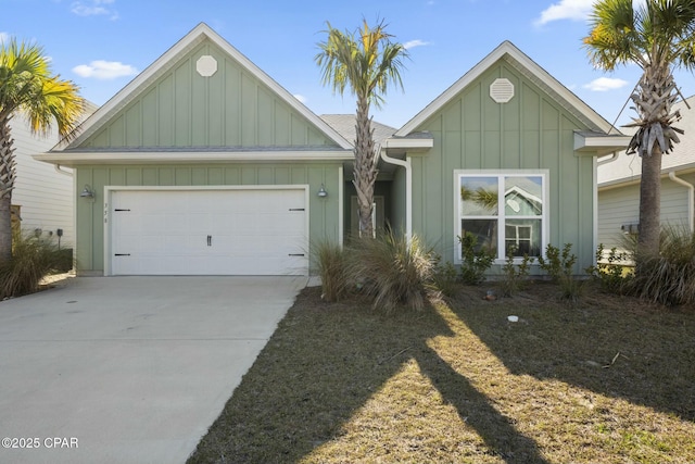 358 Sea Grove Way, Port St Joe, FL 32456 - view of front of property featuring board and batten siding, concrete driveway, and an attached garage
