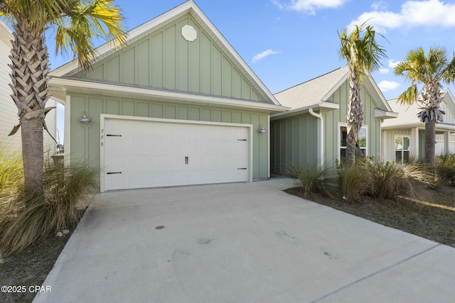358 Sea Grove Way, Port St Joe, FL 32456 - view of front facade featuring board and batten siding, a garage, and concrete driveway