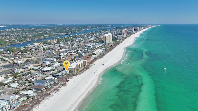 drone / aerial view with a water view and a beach view