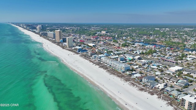 aerial view featuring a water view, a view of city, and a view of the beach