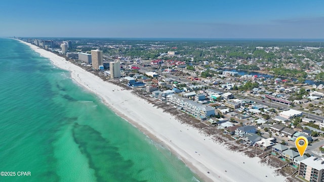 aerial view with a view of the beach, a water view, and a city view