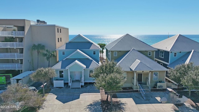 exterior space featuring entry steps and a water view