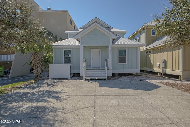 view of front of house with entry steps and metal roof