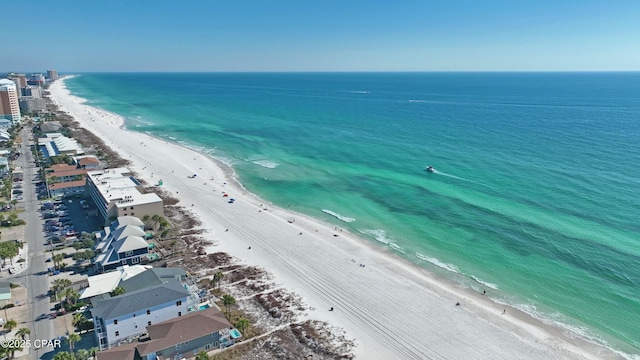 drone / aerial view featuring a water view and a beach view