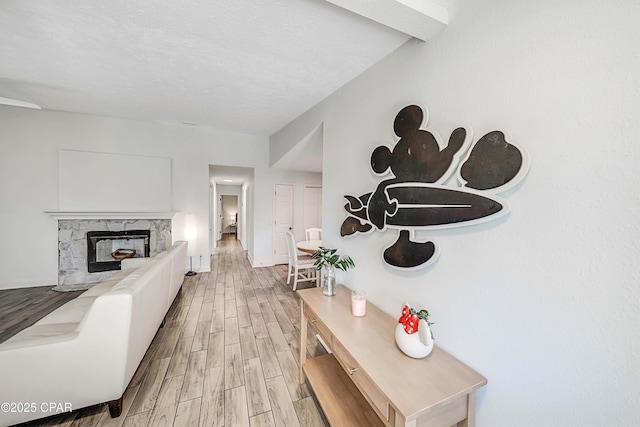 interior space featuring a textured ceiling and wood finished floors