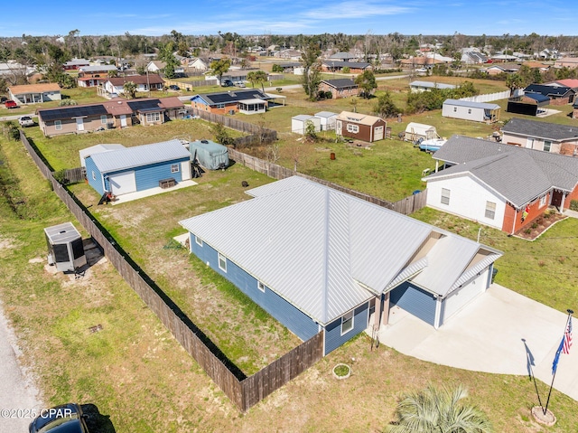 birds eye view of property with a residential view