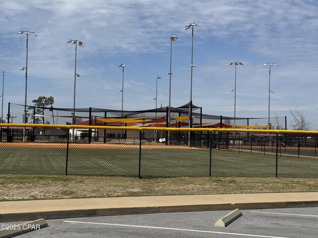 view of tennis court with fence