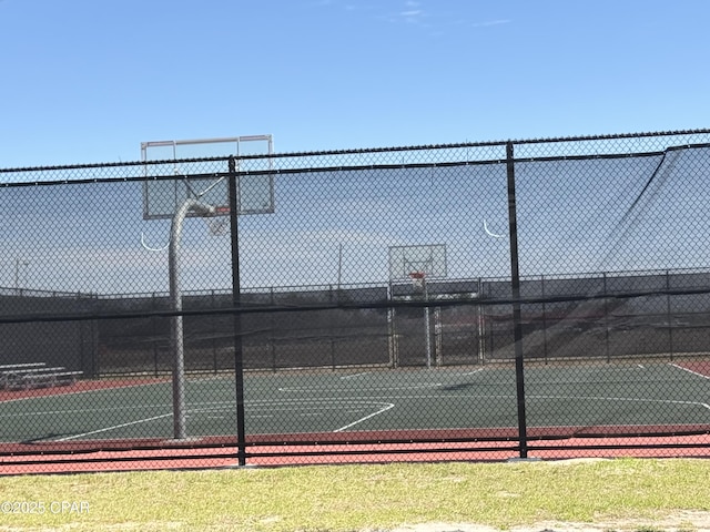 view of sport court with community basketball court and fence