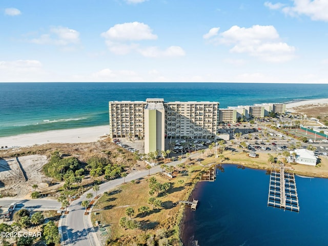 birds eye view of property with a view of city, a water view, and a beach view