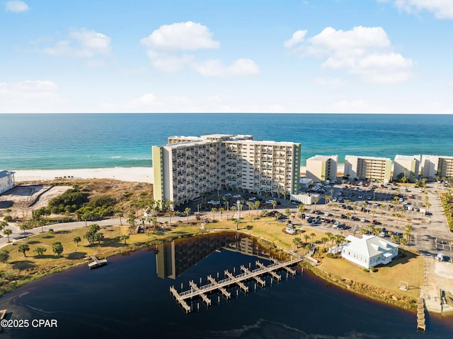 birds eye view of property with a water view and a city view