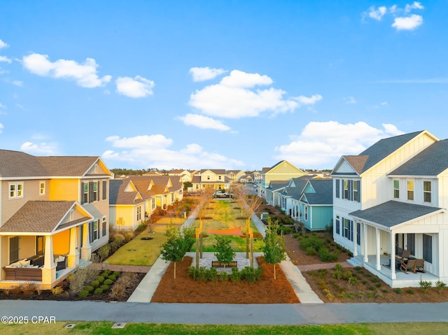 view of yard featuring a patio and a residential view