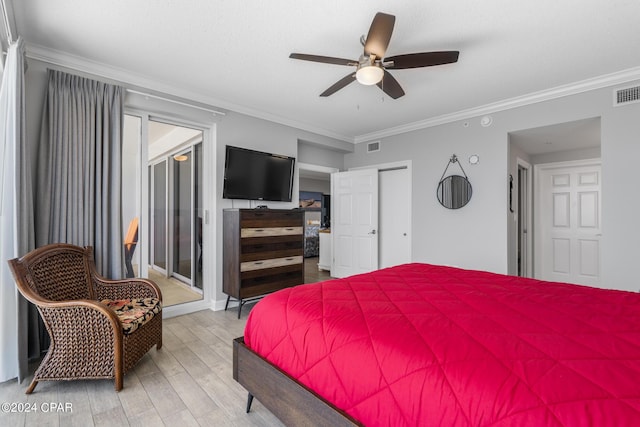 bedroom with visible vents, ornamental molding, wood finished floors, a closet, and ceiling fan