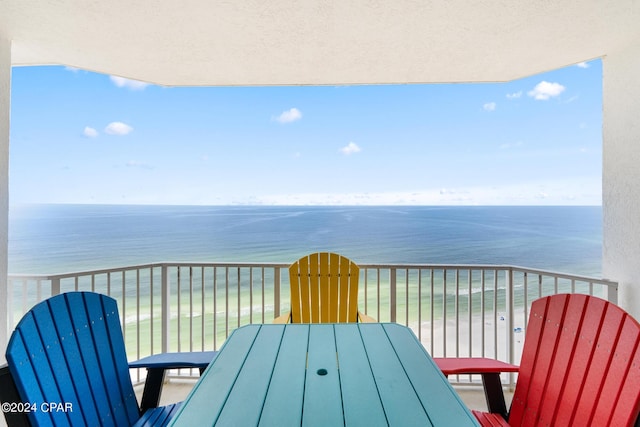 balcony featuring a water view