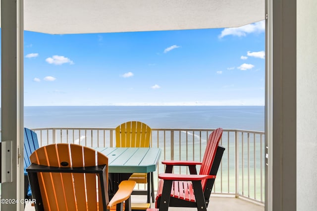 balcony featuring a water view