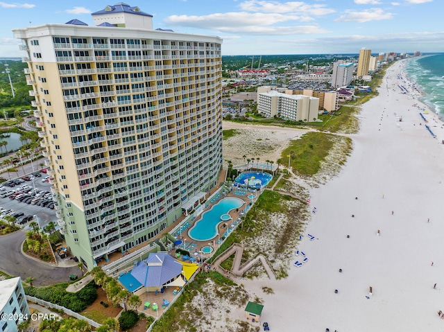 aerial view with a water view, a city view, and a view of the beach
