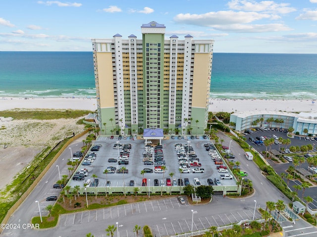 birds eye view of property featuring a water view and a view of the beach