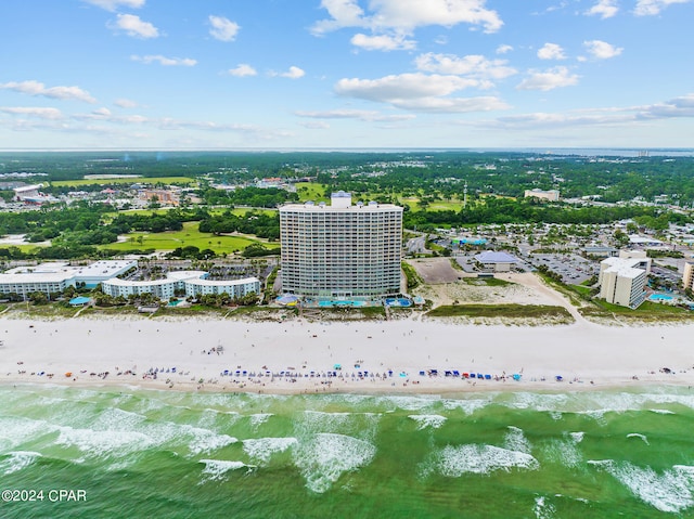 drone / aerial view featuring a water view and a beach view