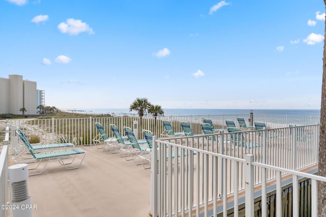 view of patio featuring a water view