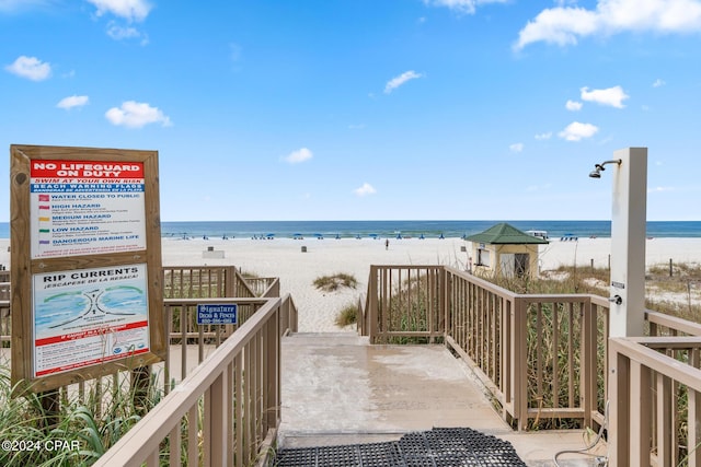 view of community featuring a water view and a view of the beach