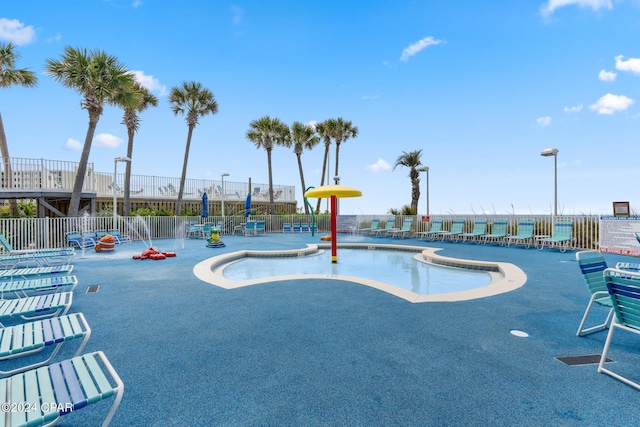 pool featuring a patio area and fence