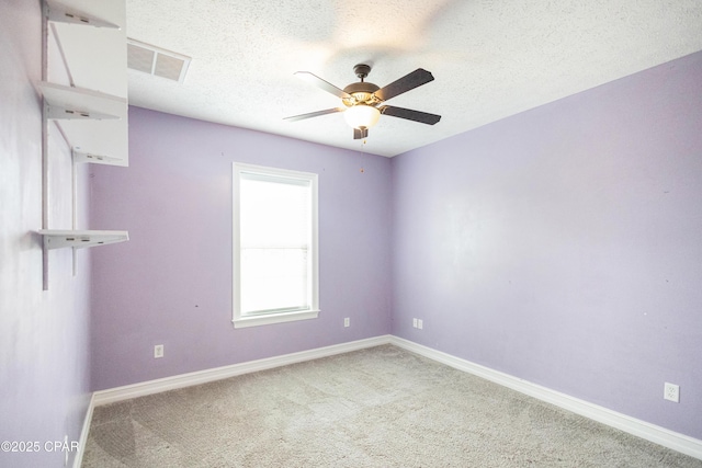 3730 Cedar Park Dr, Panama City, FL 32404 - spare room featuring a textured ceiling, carpet flooring, a ceiling fan, and visible vents