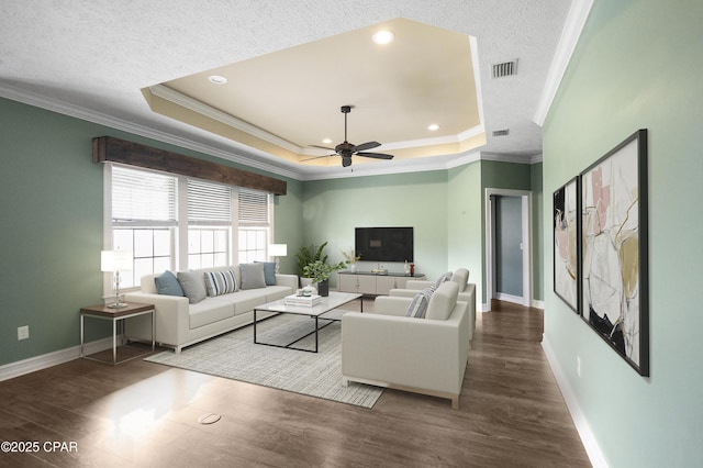 3730 Cedar Park Dr, Panama City, FL 32404 - living area with a tray ceiling, crown molding, ceiling fan, and visible vents