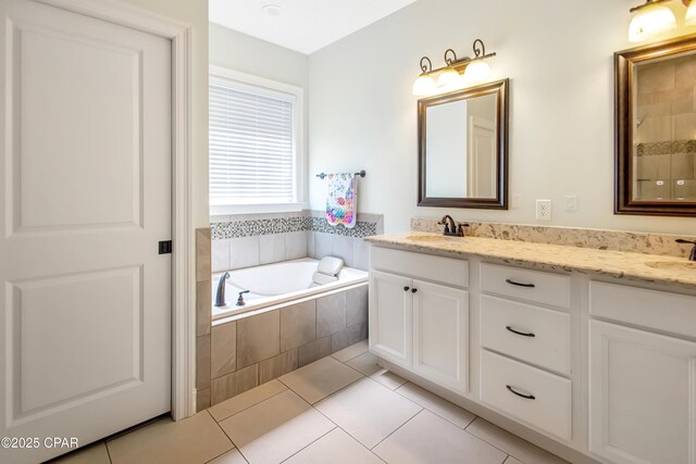 3730 Cedar Park Dr, Panama City, FL 32404 - bathroom featuring tile patterned flooring, a bath, a sink, and double vanity