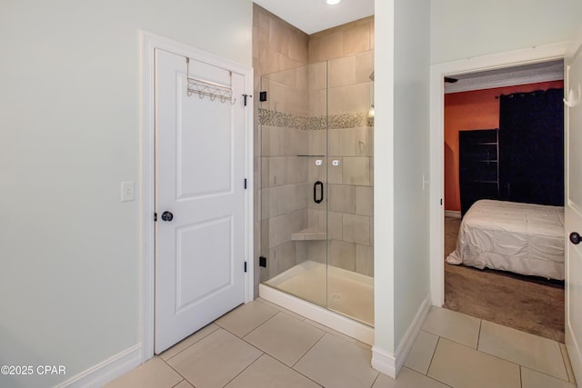 3730 Cedar Park Dr, Panama City, FL 32404 - ensuite bathroom featuring baseboards, connected bathroom, tile patterned flooring, and a stall shower
