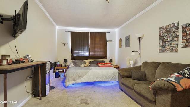 bedroom with a textured ceiling, ornamental molding, and carpet flooring