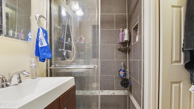 bathroom with a stall shower and vanity