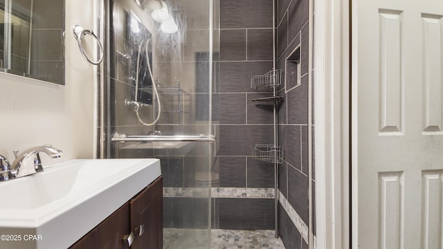 bathroom featuring vanity and a stall shower