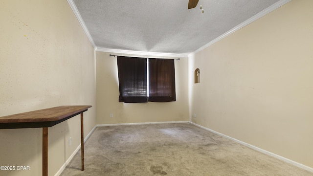 spare room with carpet flooring, ornamental molding, ceiling fan, and a textured ceiling