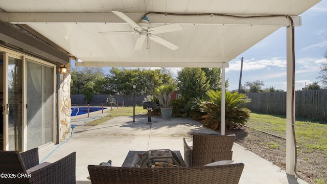 view of patio featuring a fenced backyard and a ceiling fan