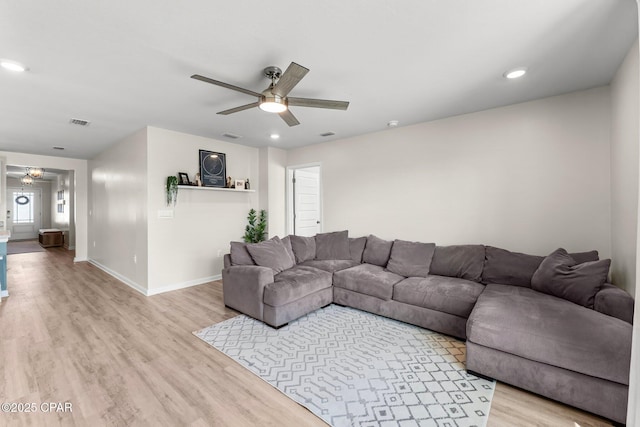 living area featuring recessed lighting, visible vents, ceiling fan, light wood-type flooring, and baseboards