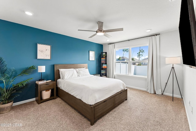 bedroom featuring recessed lighting, baseboards, a ceiling fan, and light colored carpet