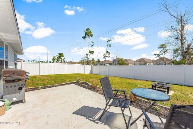 view of patio with a fenced backyard and area for grilling