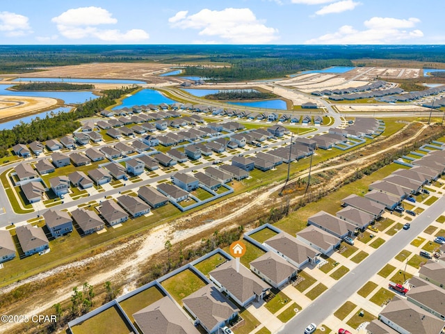 aerial view featuring a residential view and a water view