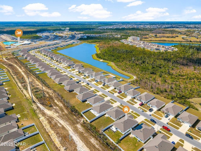 birds eye view of property with a residential view and a water view