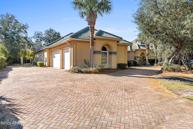 exterior space with decorative driveway