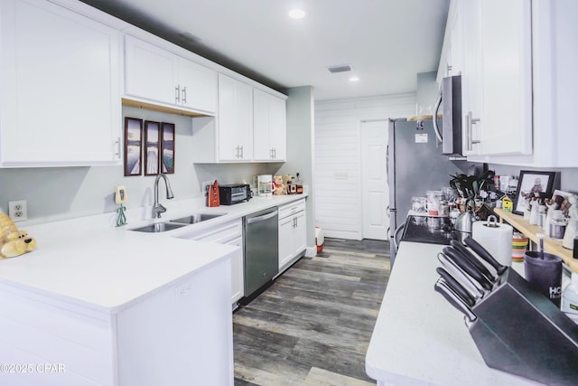 5429 Blue Dog Rd, Panama City, FL 32404 - kitchen featuring stainless steel appliances, a sink, white cabinets, recessed lighting, and light countertops