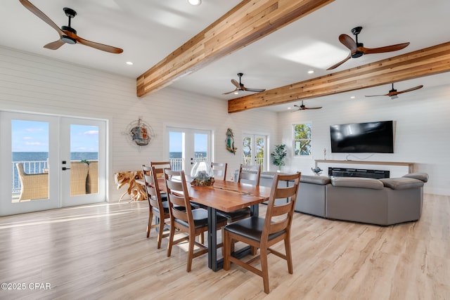 dining area with recessed lighting, french doors, light wood finished floors, and beam ceiling